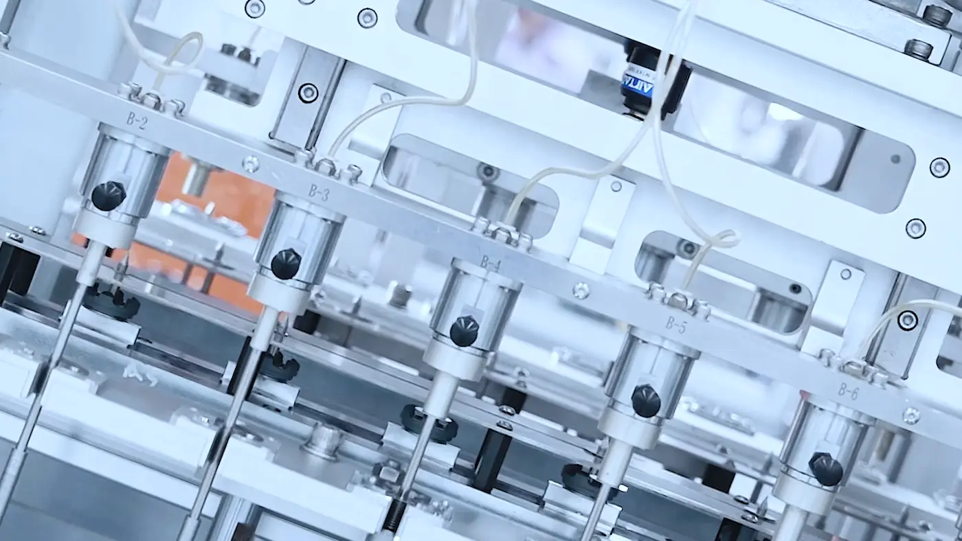 Automated suspension-part handling within a selected manufacturing program